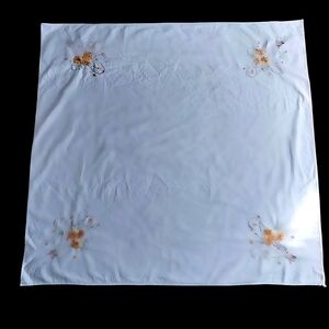 Embroidered White Tablecloth with Amber Floral Accents